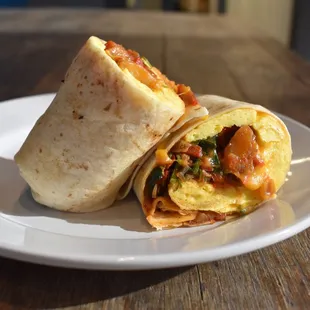 a breakfast burrito on a plate