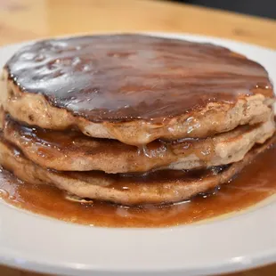 a stack of pancakes covered in syrup