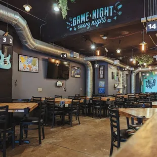 the inside of a restaurant with tables and chairs