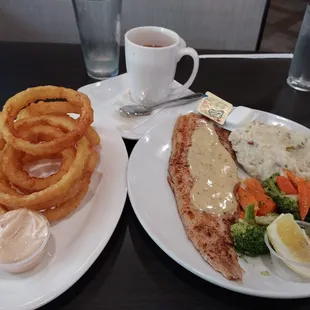 Onion rings and grilled white fish. homemade mashed potatoes