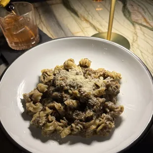 Radiatori with mushrooms, red wine ragu, and yummy black truffle pate