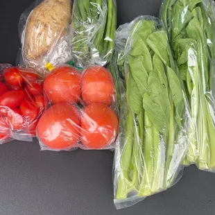 Tomatoes, Choy sum, green beans and Okinawan sweet potatoes