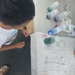 Choosing the color of his lava lamp at Healthy Kids Event