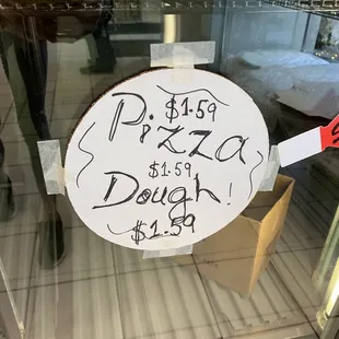 a pizza sign in a display case