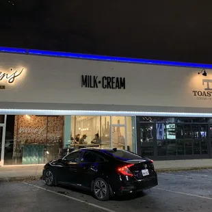 a car parked in front of a building