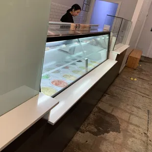 a woman behind the counter