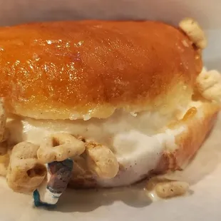 Glazed donut with ceral milk icecream and lucky charms