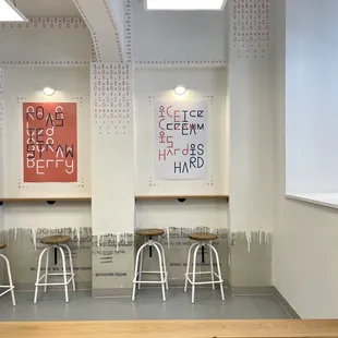 a row of stools in a coffee shop