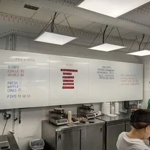 a man and a woman in a kitchen