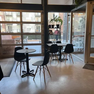 tables and chairs in a coffee shop