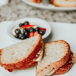 Prosciutto, Egg and Smoked Mozz Sandwich with Fresh Berries and Pineapple