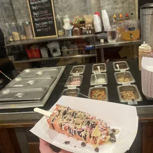 a person holding a plate of food