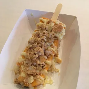 Thai tea with graham cracker, white chocolate drizzle and condensed milk.