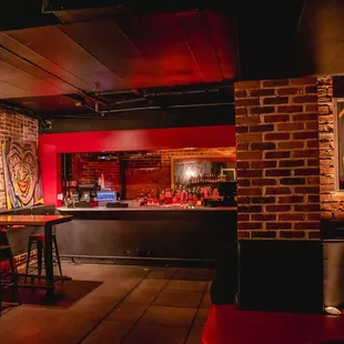 a brick bar with a red light