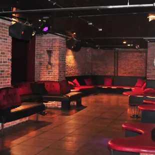red couches and black chairs