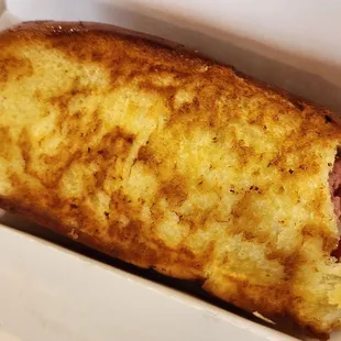 Hot dog is served on a grilled and buttered split top roll! Delicious!