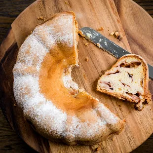 a half eaten doughnut on a cutting board