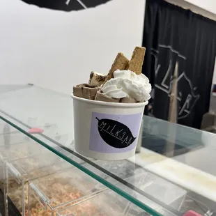 a cup of ice cream and sprinkles