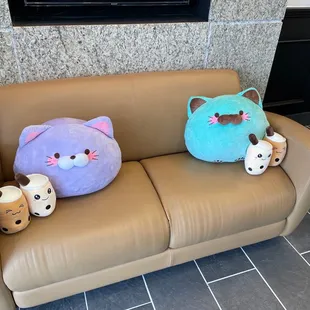a couch with two stuffed animals on it