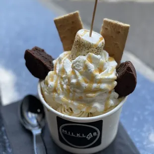 Campfire Rolled Ice Cream with vanilla ice cream (instead of chocolate) and caramel (instead of chocolate syrup).