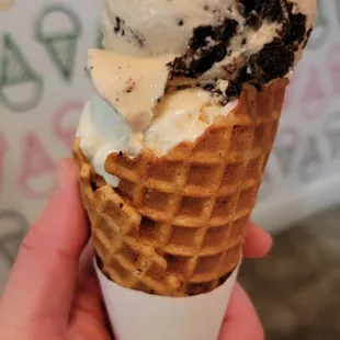 PB Cookies &amp; Cream and Happy Wife split-scoop in a brown butter brown sugar waffle cone