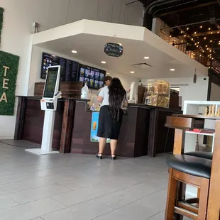 a woman standing at a counter