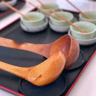 wooden spoons and bowls of tea
