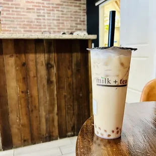 Delicious mango milk tea with golden boba! Always great here! Reg ice &amp; half sugar!