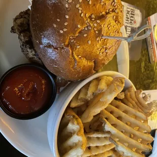 Fried chickens sandwich and waffles fries.