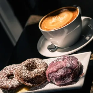 two donuts and a cup of coffee