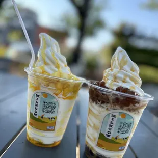 two cups of ice cream on a table