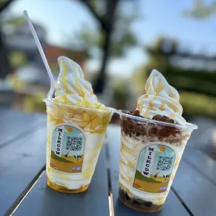 two cups of ice cream on a table