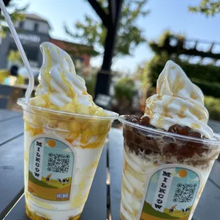 two cups of ice cream on a table