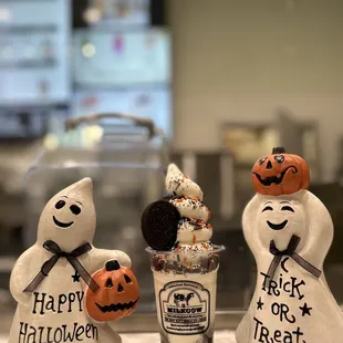 three halloween decorations on a counter