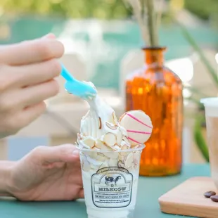 a person eating a cup of ice cream