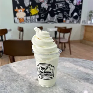 a cup of whipped cream on a table