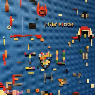 a wall of legos with the words milkfloat on it