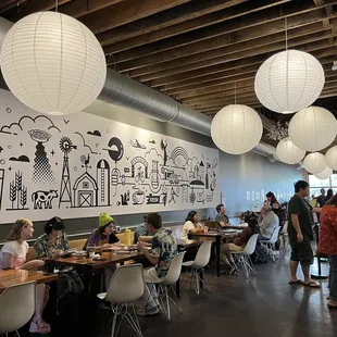 a group of people eating at a restaurant