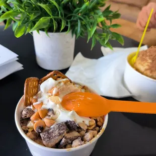 a bowl of ice cream and pretzels