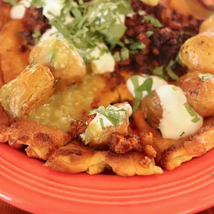 savory dutch pancake with housemade chorizo, fingerling potatoes, salsa verde, crema, and cilantro