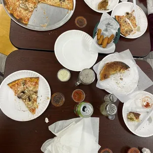 Mushroom pizza thin crust, spinach baked good, mozzarella cheese sticks and marinara sauce.