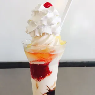 a milkshake with a cherry on top