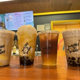 Milky tea with pudding, mango snowthie, black lemon tea, and milky tea with boba