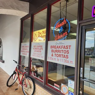 a bicycle parked in front of the store