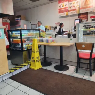 a counter with a sign in front of it