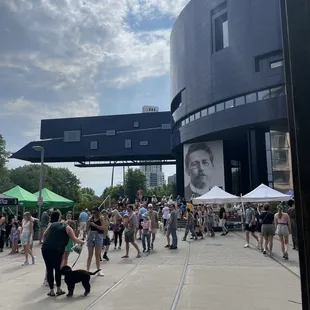 a crowd of people and a dog