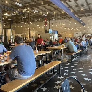 a large group of people sitting at tables