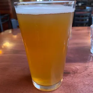 a glass of beer on a table