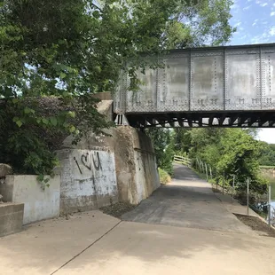 Trail under railroad bridge along Mill Creek