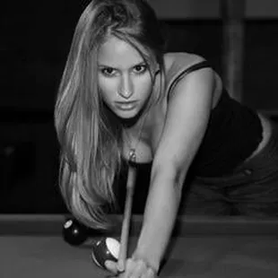 a woman playing pool